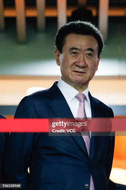 Wang Jianlin, Chairman and President of Dalian Wanda Group Co., watches from the stand during the 2018 China Cup International Football Championship...