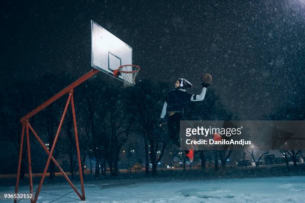 powerful image of an athlete man slam dunking