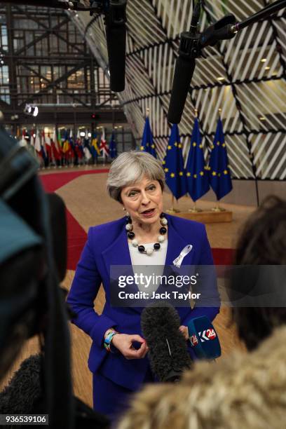 British Prime Minister Theresa May arrives at the Council of the European Union for the first day of the European Council leaders' summit on March...