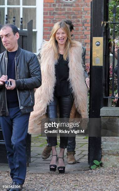 Kate Moss leaves her house with husband Jamie Hince on her birthday on January 16, 2015 in London, England.