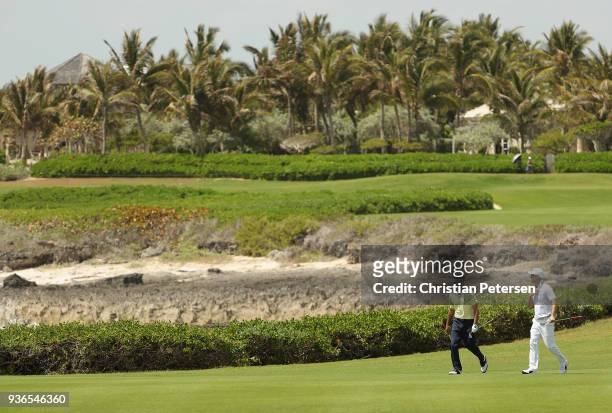Jonathan Byrd and Ben Crane walk up the 18th fairway during round one of the Corales Puntacana Resort & Club Championship on March 26, 2018 in Punta...