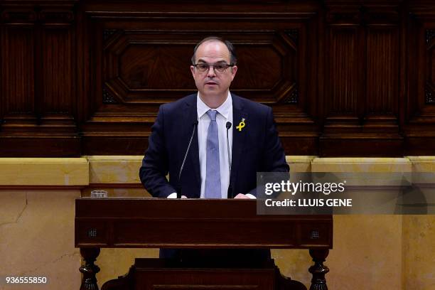 Junts per Catalonia' - JUNTSXCAT member of Catalonia's parliament Jordi Turull gives a speech during a parliament session in Barcelona to vote for...