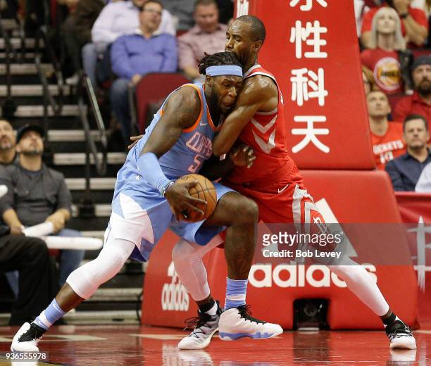 Montreal Harrell of the LA Clippers drives on Luc Mbah a Moute of the Houston Rockets at Toyota Center on March 15, 2018 in Houston, Texas. NOTE TO...