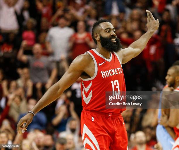 James Harden of the Houston Rockets celebrates a three point basket shot against the LA Clippers at Toyota Center on March 15, 2018 in Houston,...