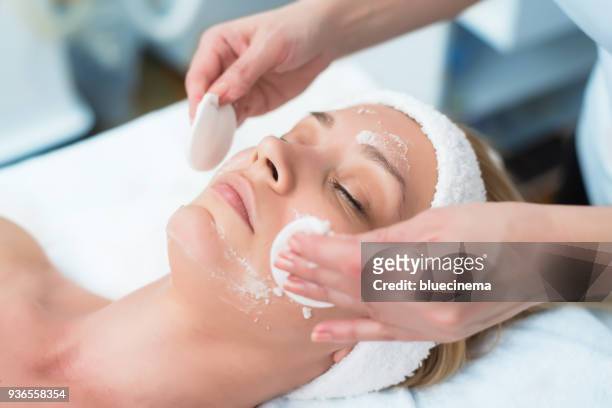 picture of a person receiving facial exfoliation - clay mask face woman stock pictures, royalty-free photos & images