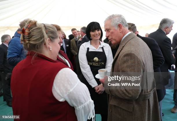 Prince Charles, Prince of Wales chats with staff from the Little Cornish Pantry during a visit to Nansledan in Cornwall where he met local residents...