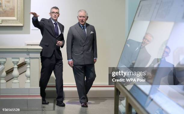 Prince Charles, Prince of Wales walks with Director of the Royal Cornwall Museum Ian Wall during a visit to the Royal Cornwall Museum in Truro to...