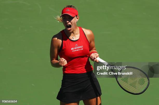 Angelique Kerber of Germany celebrates a break point against Johanna Larsson of Sweden in their second round match during the Miami Open Presented by...