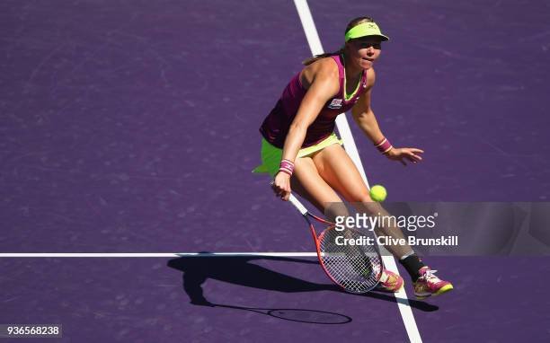 Johanna Larsson of Sweden plays a backhand volley against Angelique Kerber of Germany in their second round match during the Miami Open Presented by...