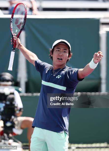 Yoshihito Nishioka of Japan celebrates his win against Alex de Minaur of Australia during Day 4 of the Miami Open at the Crandon Park Tennis Center...