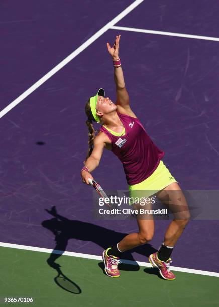 Johanna Larsson of Sweden serves against Angelique Kerber of Germany in their second round match during the Miami Open Presented by Itau at Crandon...