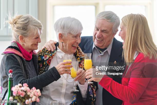 vacker äldre kvinna firar mors dag - mimosa bildbanksfoton och bilder