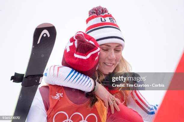 Silver medalist Mikaela Shiffrin of the United States and bronze medalist Wendy Holdener from Switzerland hug as the result is confirmed during the...