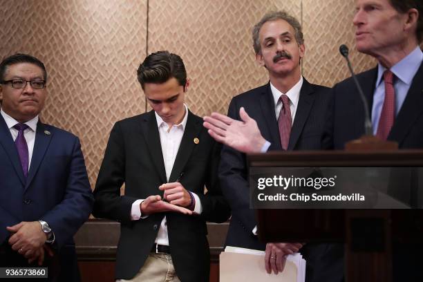 Marjory Stoneman Douglas High School shooting survivor David Hogg jots notes on his hand as he joins a news conference with Rep. Salud Carbajal , Los...