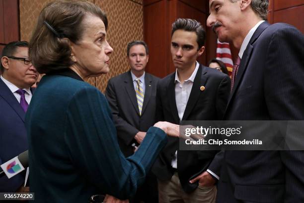 Sen. Dianne Feinstein talks with Marjory Stoneman Douglas High School shooting survivor David Hogg and Los Angeles City Attorney Mike Feuer ahead of...