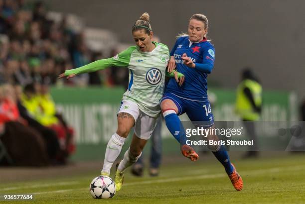 Anna Blaesse of VfL Wolfsburg is challenged by Sandra Jessen during the UEFA Women's Champions League Quarter Final first leg match between VfL...