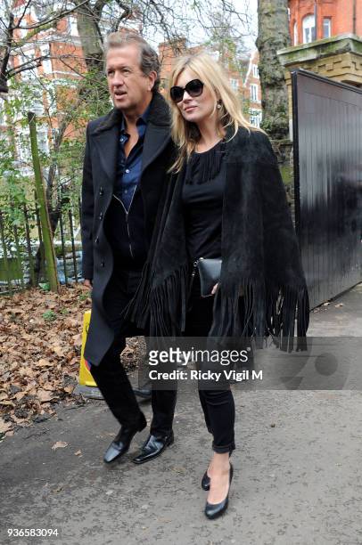 Kate Moss and Mario Testino attend the Burberry Prorsum show a/w 2015 during London Fashion Week on February 23, 2015 in London, England.