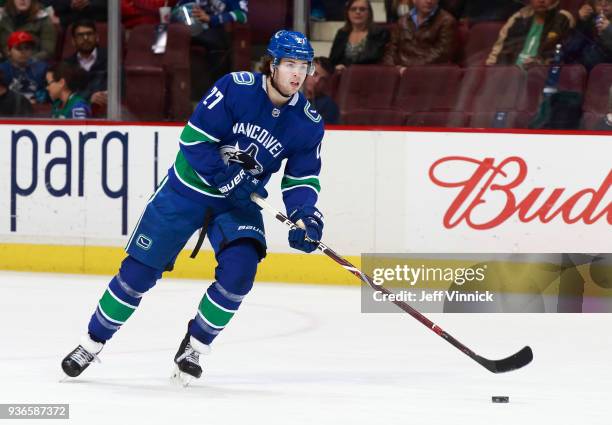 Ben Hutton of the Vancouver Canucks skates up ice with the puck during their NHL game against the Arizona Coyotes at Rogers Arena March 7, 2018 in...