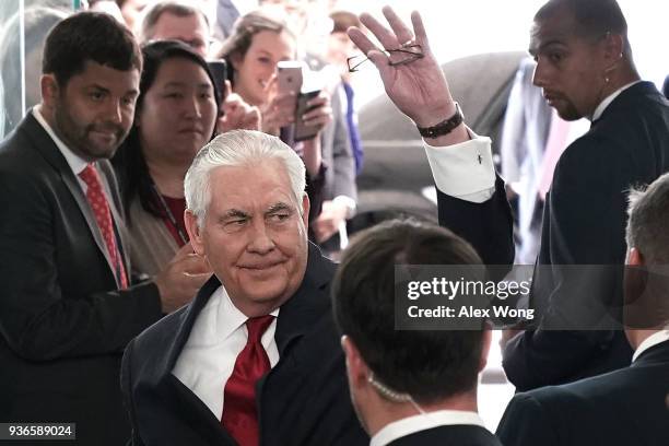 Outgoing U.S. Secretary of State Rex Tillerson waves to State Department employees before his departure March 22, 2018 at the State Department in...