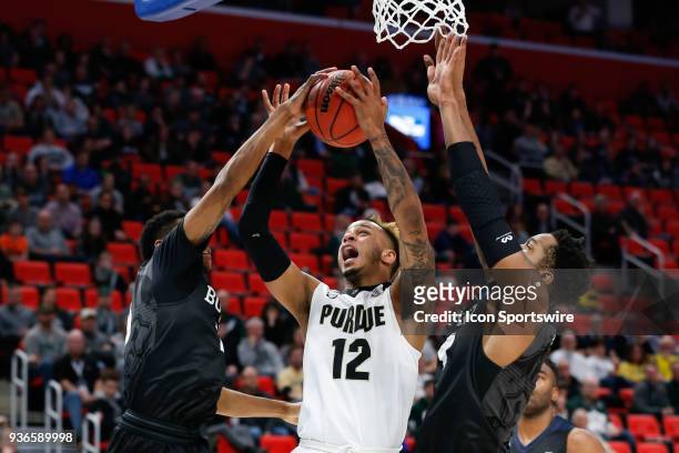 Purdue Boilermakers forward Vincent Edwards shoots over Butler Bulldogs guard Henry Baddley and Butler Bulldogs forward Tyler Wideman during the NCAA...