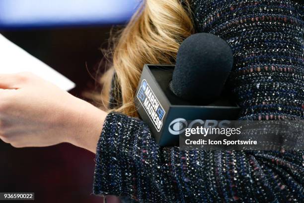 Detail view of the CBS and March Madness logos displayed on a microphone during the NCAA Division I Men's Championship Second Round basketball game...