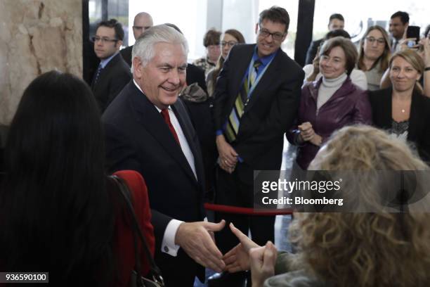Outgoing U.S. Secretary of State Rex Tillerson shakes hands with an attendee after delivering farewell remarks at the U.S. State Department in...