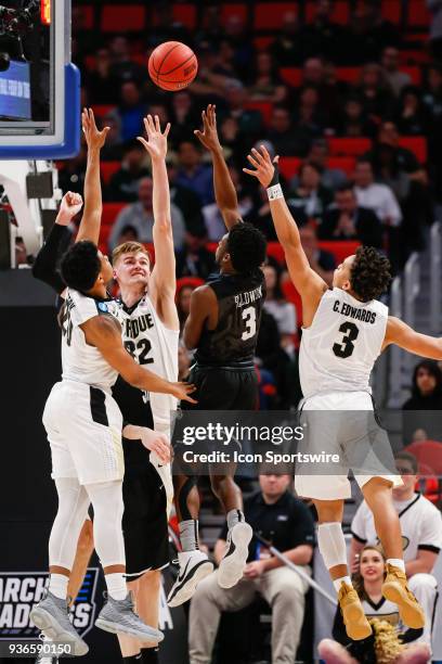 Butler Bulldogs guard Kamar Baldwin shoots over Purdue Boilermakers forward Matt Haarms , Purdue Boilermakers guard Nojel Eastern , and Purdue...