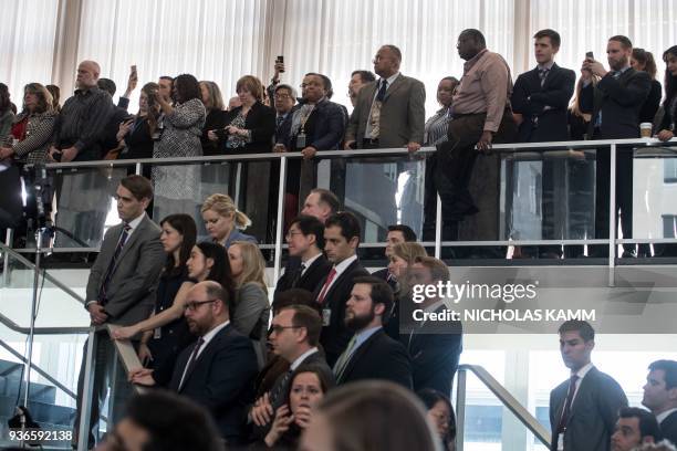 State Department staff listen to outgoing US Secretary of Sate Rex Tillerson as he bids them farewell at the State Department in Washington, DC, on...