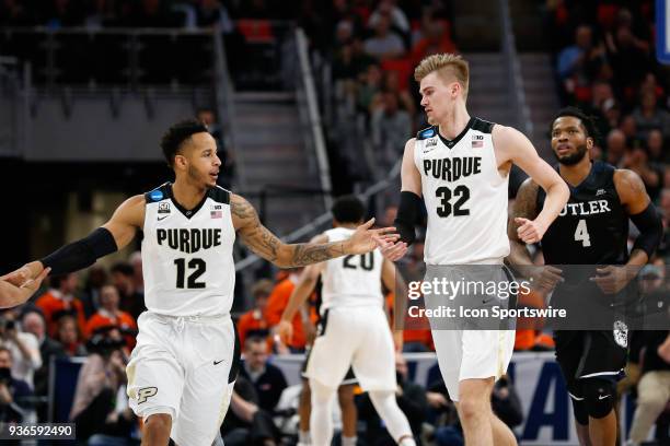 Purdue Boilermakers forward Vincent Edwards and Purdue Boilermakers forward Matt Haarms slap hands during the NCAA Division I Men's Championship...