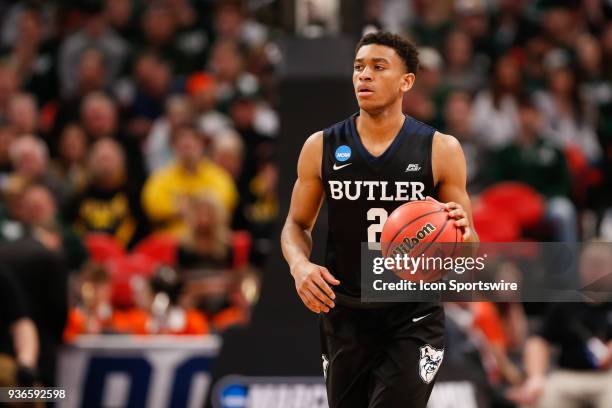 Butler Bulldogs guard Aaron Thompson brings the ball up the court during the NCAA Division I Men's Championship Second Round basketball game between...