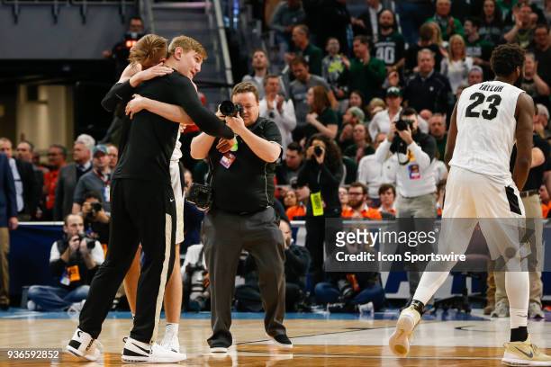 Purdue Boilermakers forward Matt Haarms hugs injured Purdue Boilermakers center Isaac Haas at the conclusion of the NCAA Division I Men's...