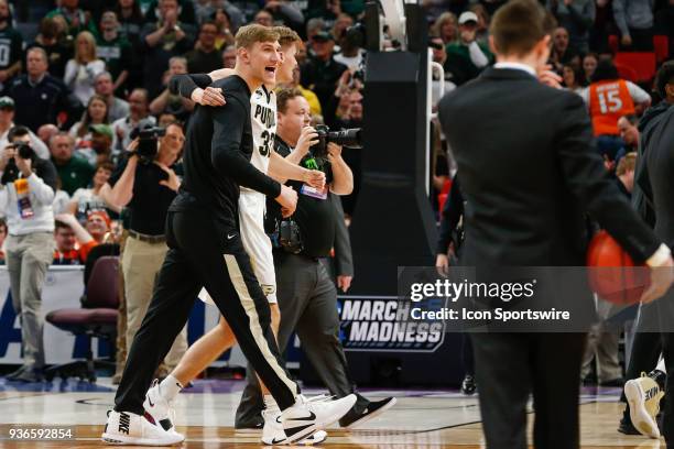 Purdue Boilermakers forward Matt Haarms hugs injured Purdue Boilermakers center Isaac Haas at the conclusion of the NCAA Division I Men's...