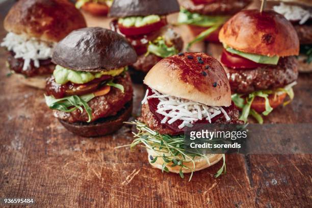 tasty mini burgers - little burger stock pictures, royalty-free photos & images