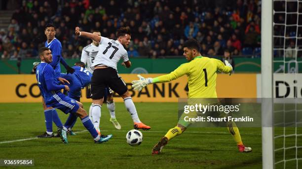 Eduard Loewen of Germany scores his team's first goal past goalkeeper Omri Glazer of Israel during the 2019 UEFA Under21 European Championship...