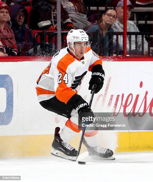 Matt Read of the Philadelphia Flyers controls the puck along the boards during an NHL game against the Carolina Hurricanes on March 17, 2018 at PNC...