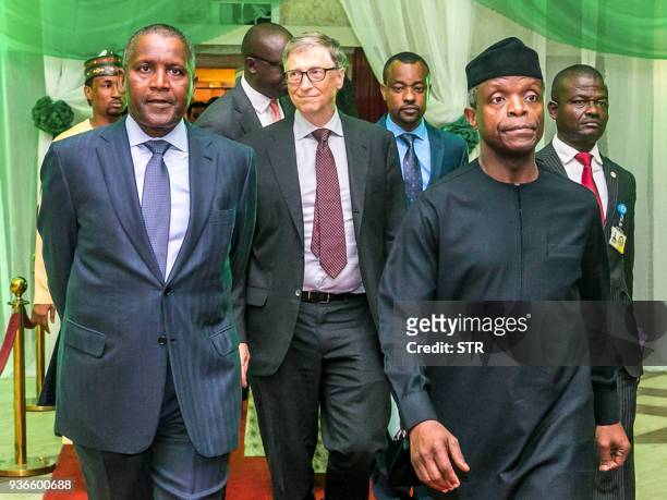 Nigeria's Vice President Yemi Osinbajo , Nigerian billionaire Aliko Dangote , and Microsoft founder Bill Gates arrive to attend the closing ceremony...