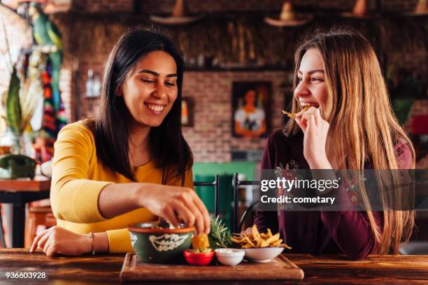 different taste - restaurant women friends lunch stock pictures, royalty-free photos & images