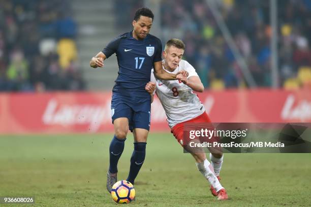 Chris Willock of England competes with Sebastian Milewski of Poland during the U20 Elite League match between Poland and England at the Municipal...