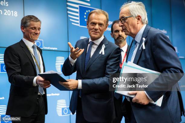 President of the European Council Donald Tusk and President of the European Commission Jean-Claude Juncker leave following a press conference after a...