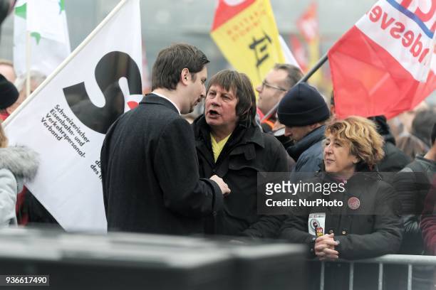 General secretary of trade union CGT of cheminots Laurent Brun speaks with former French CGT workers' union chairman Bernard Thibault during a...