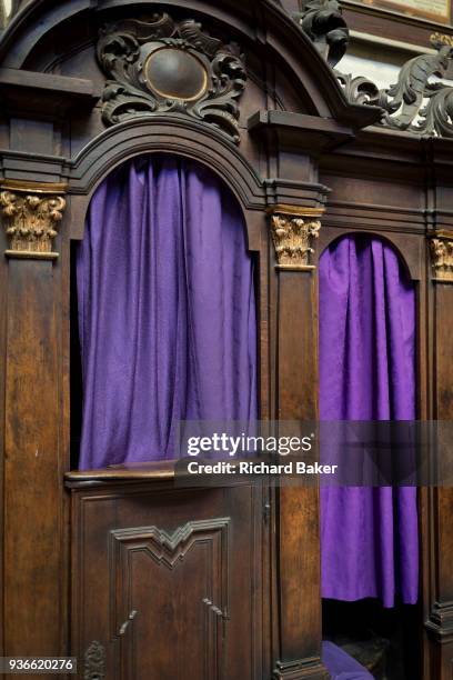 Purple Catholic confessional curtains in St Vitas' Cathedral in Prague Castle, on 18th March in Prague, the Czech Republic. The Metropolitan...