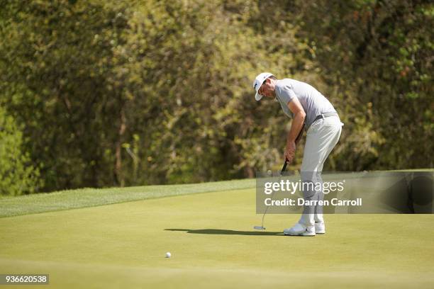 Keegan Bradley of the United States putts on the first green during the second round of the World Golf Championships-Dell Match Play at Austin...