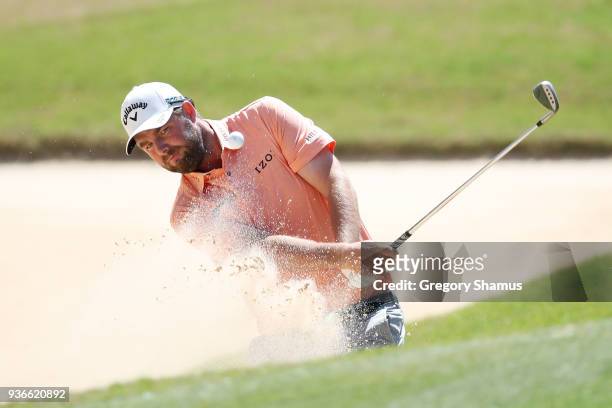 Marc Leishman of Australia plays a shot from a bunker on the seventh hole during the second round of the World Golf Championships-Dell Match Play at...