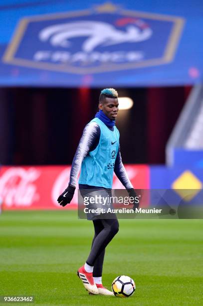 Paul Pogba warms up during a France football team training session before the friendly match against Colombia on March 22, 2018 in Paris, France.