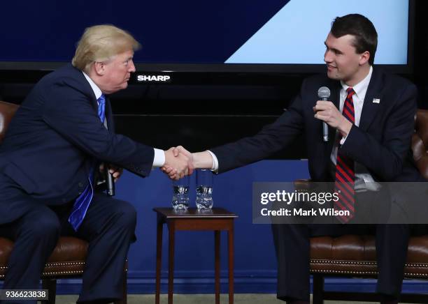 President Donald Trump shakes hands with conservative activist Charlie Kirk at a forum dubbed the Generation Next Summit at the White House on March...