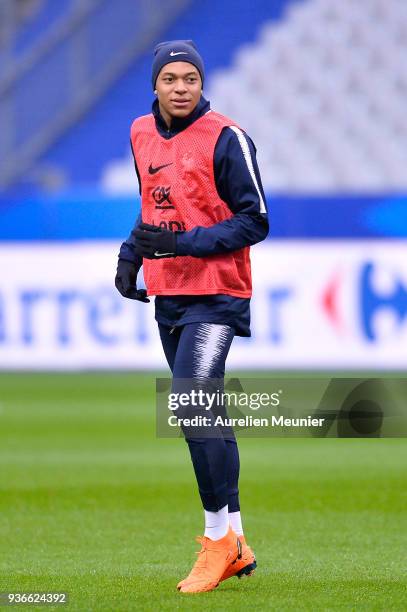 Kylian Mbappe warms up during a France football team training session before the friendly match against Colombia on March 22, 2018 in Paris, France.