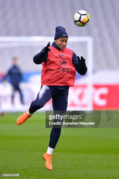 Kylian Mbappe warms up during a France football team training session before the friendly match against Colombia on March 22, 2018 in Paris, France.