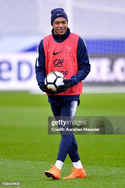 Kylian Mbappe warms up during a France football team training session before the friendly match against Colombia on March 22, 2018 in Paris, France.