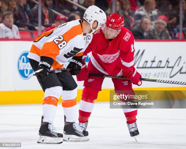 Gustav Nyquist of the Detroit Red Wings talks to Claude Giroux of the Philadelphia Flyers before a face off during an NHL game at Little Caesars...