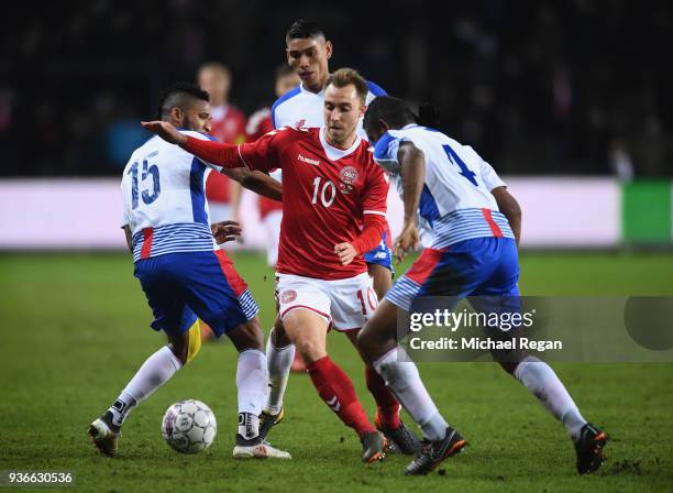 Christian Eriksen of Denmark is challenged by Eric Davis and Fidel Escobar of Panama during the International Friendly match between Denmark and...